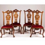 A set of four D.João V(1707-1750)/D.José (1750-1777) chairsWalnut Scalloped and pierced backs Carved