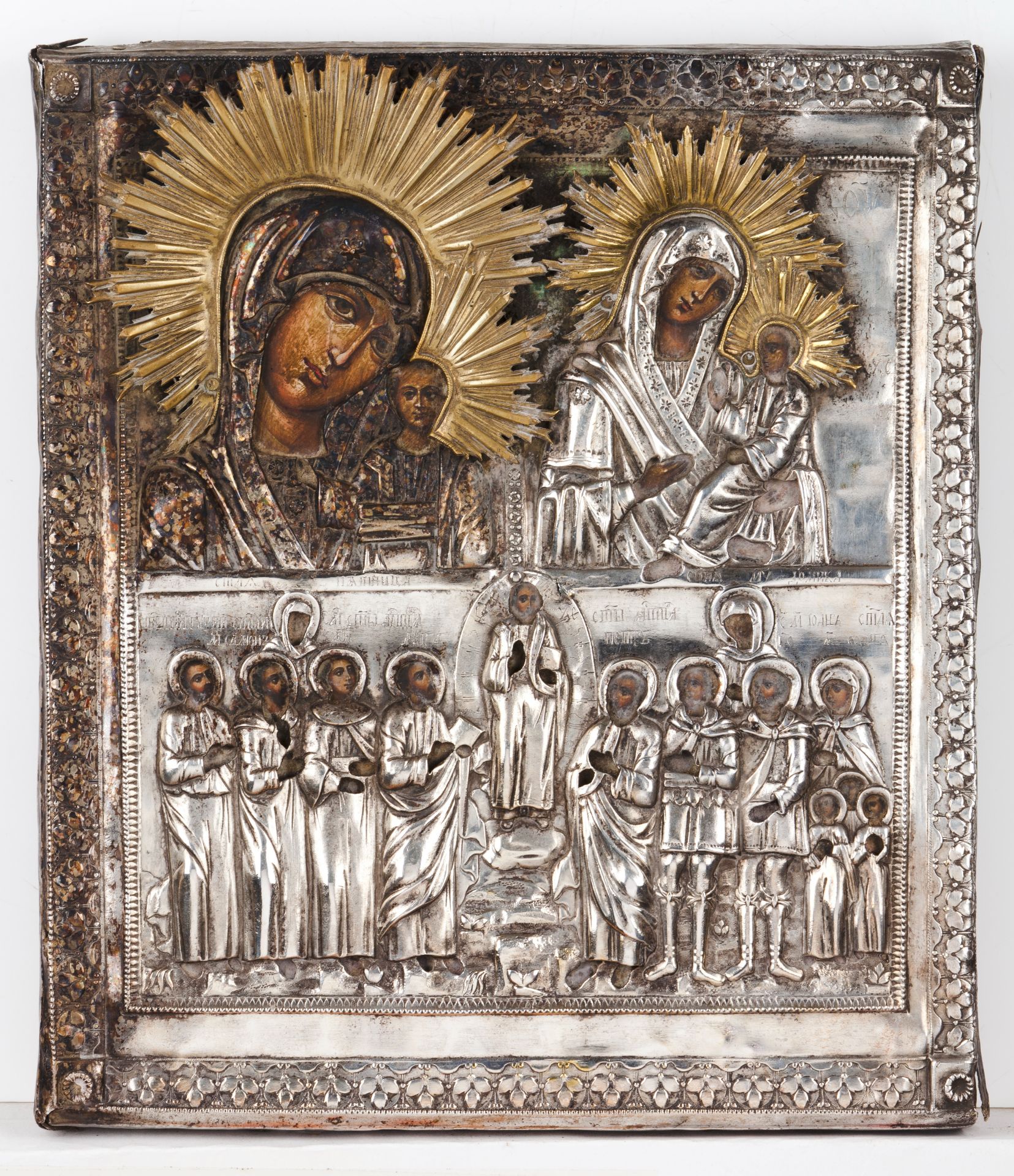 A Russian iconPainted on board Depicting on the upper section the Virgin and Child and on the