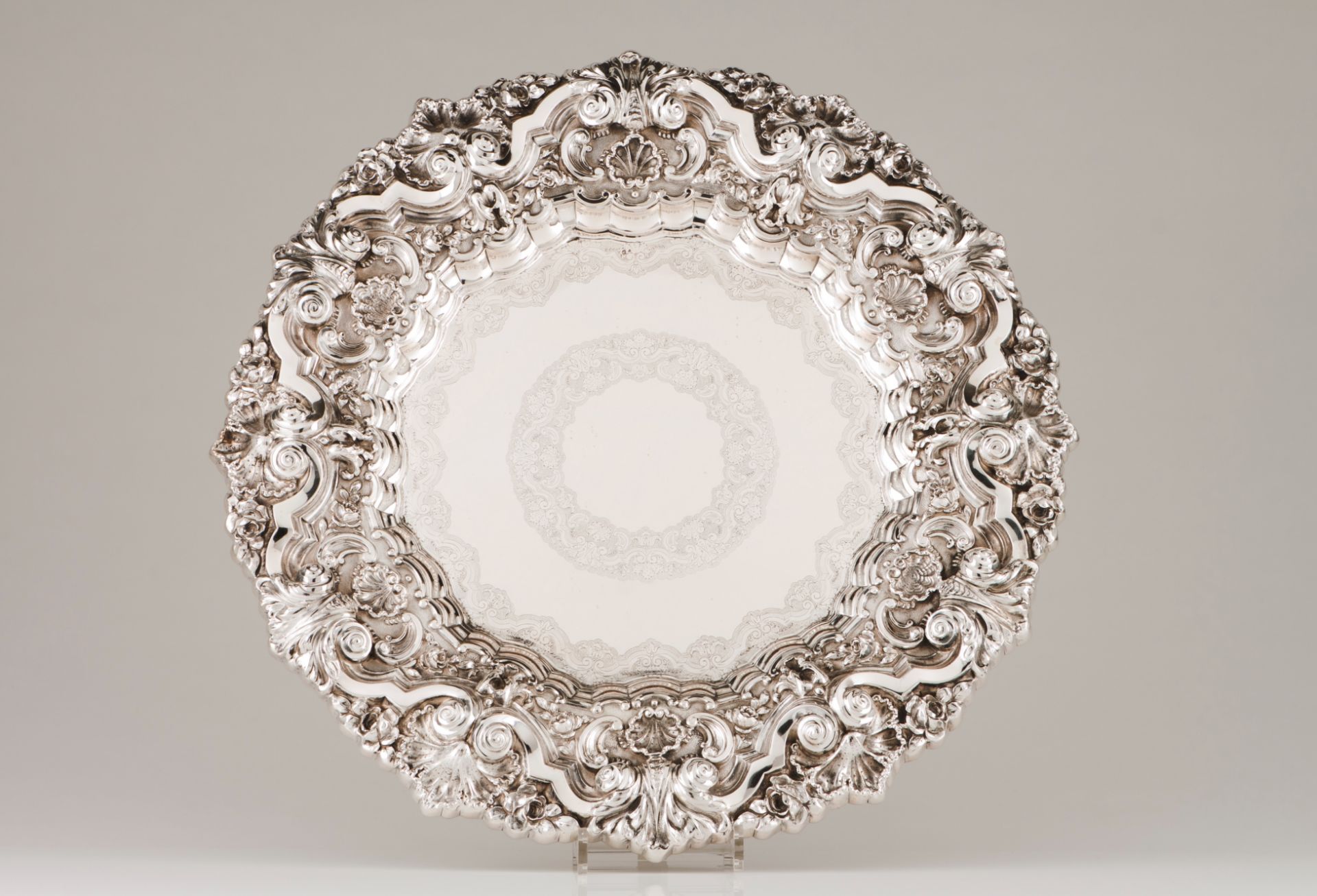 A large display salverPortuguese silver Plain centre of double chiselled band with foliage motifs
