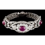 A braceletPlatinum and white gold Set with three cabochon rubies (ca. 11x8mm) and (10x7mm) 36