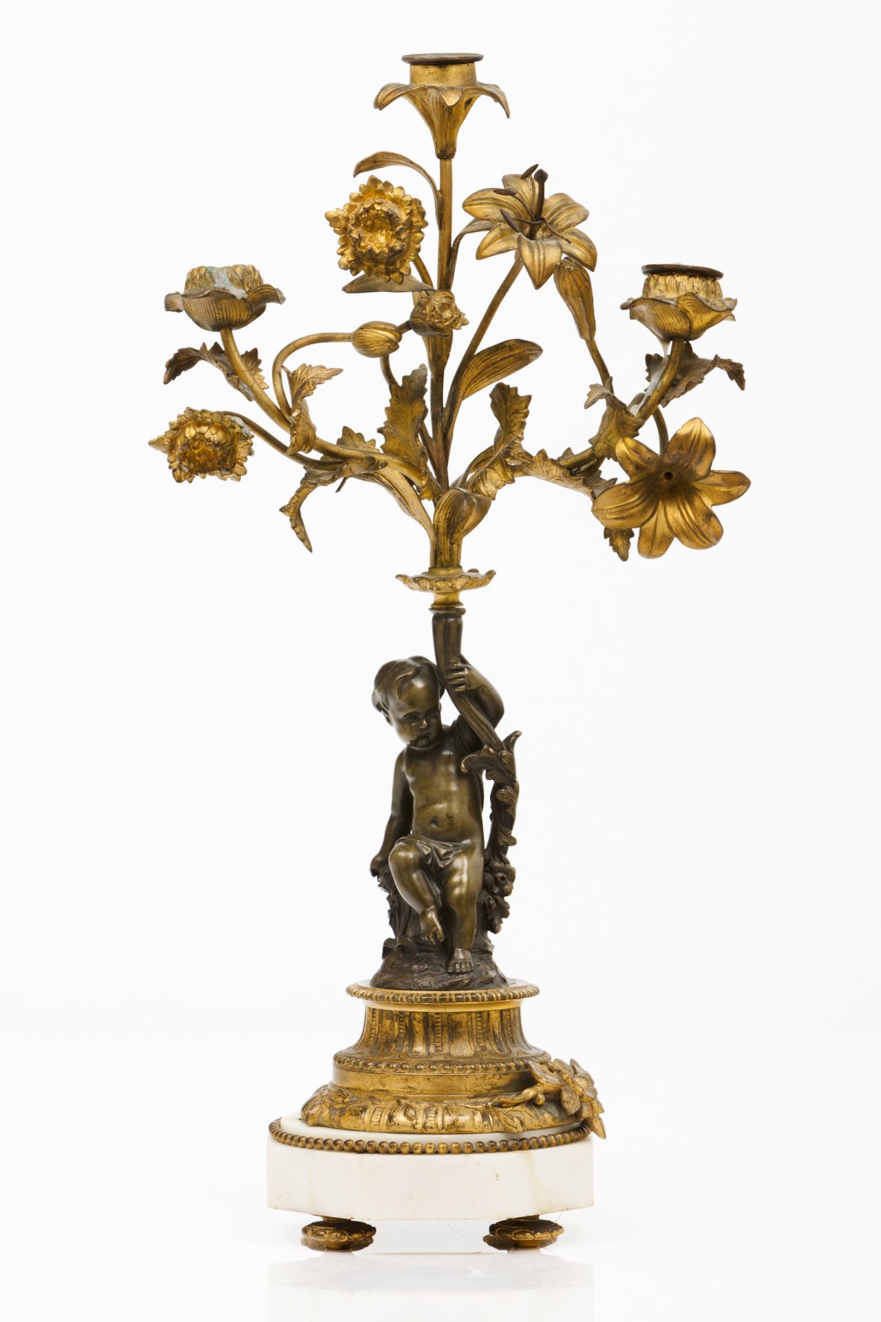 A candelabraGilt and patinated bronze Cherub holding flower bouquet Marble stand France, 19th