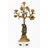 A candelabraGilt and patinated bronze Cherub holding flower bouquet Marble stand France, 19th