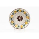 A bowlPortuguese faience Polychrome floral decoration 19th centuryDiam.: 21 cm