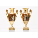 A pair of Empire vasesFrench porcelain Gilt and painted decoration depicting domestic scenes with