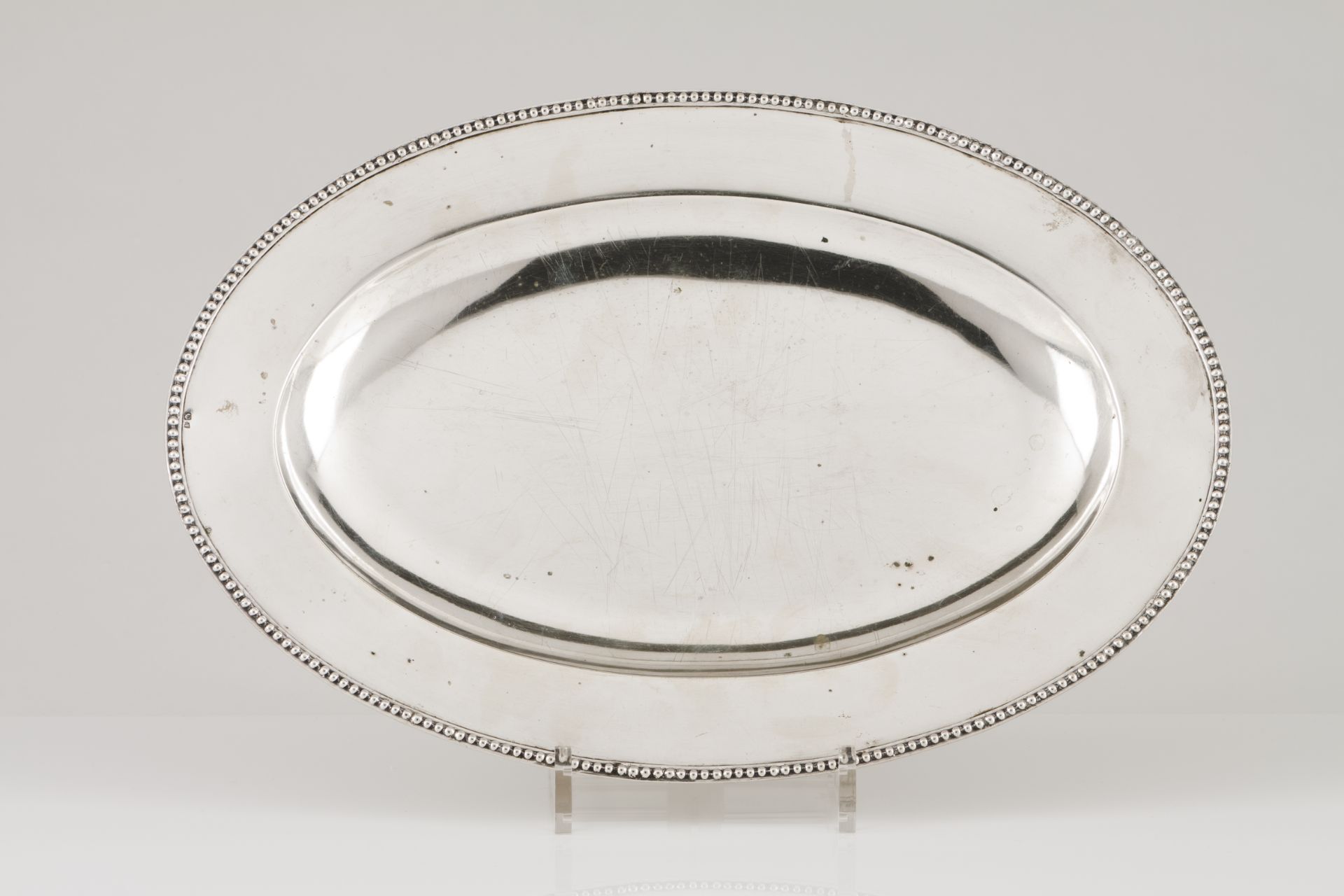 An elliptic serving platterPortuguese silver Plain centre of beaded frieze Boar hallmark 833/1000 (