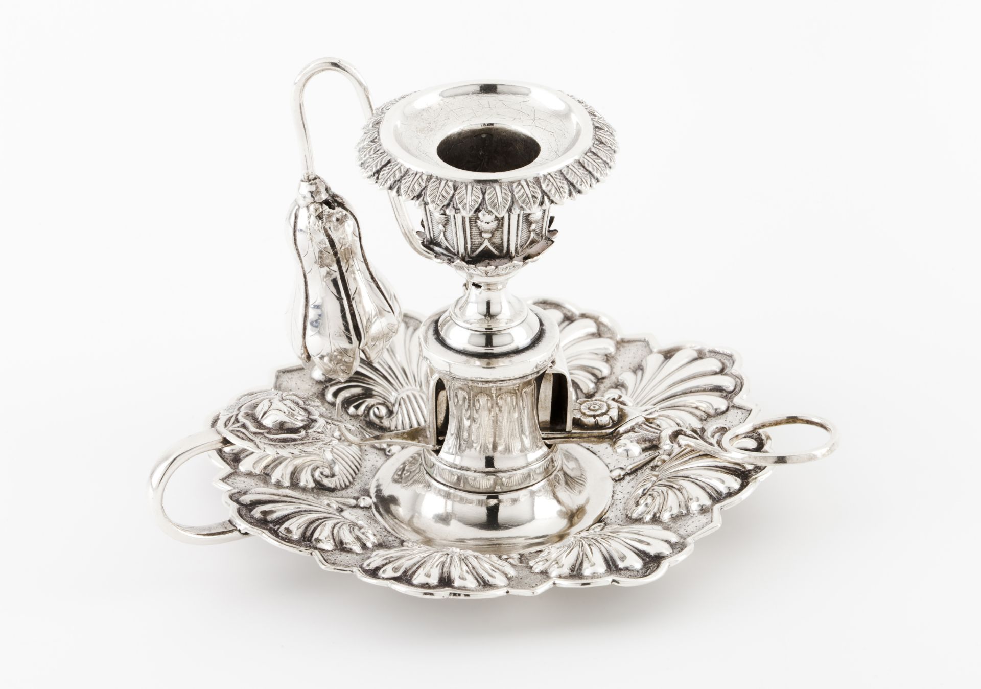 A chamberstick with snufferPortuguese silver Stand of raised shell decoration, tulip shaped