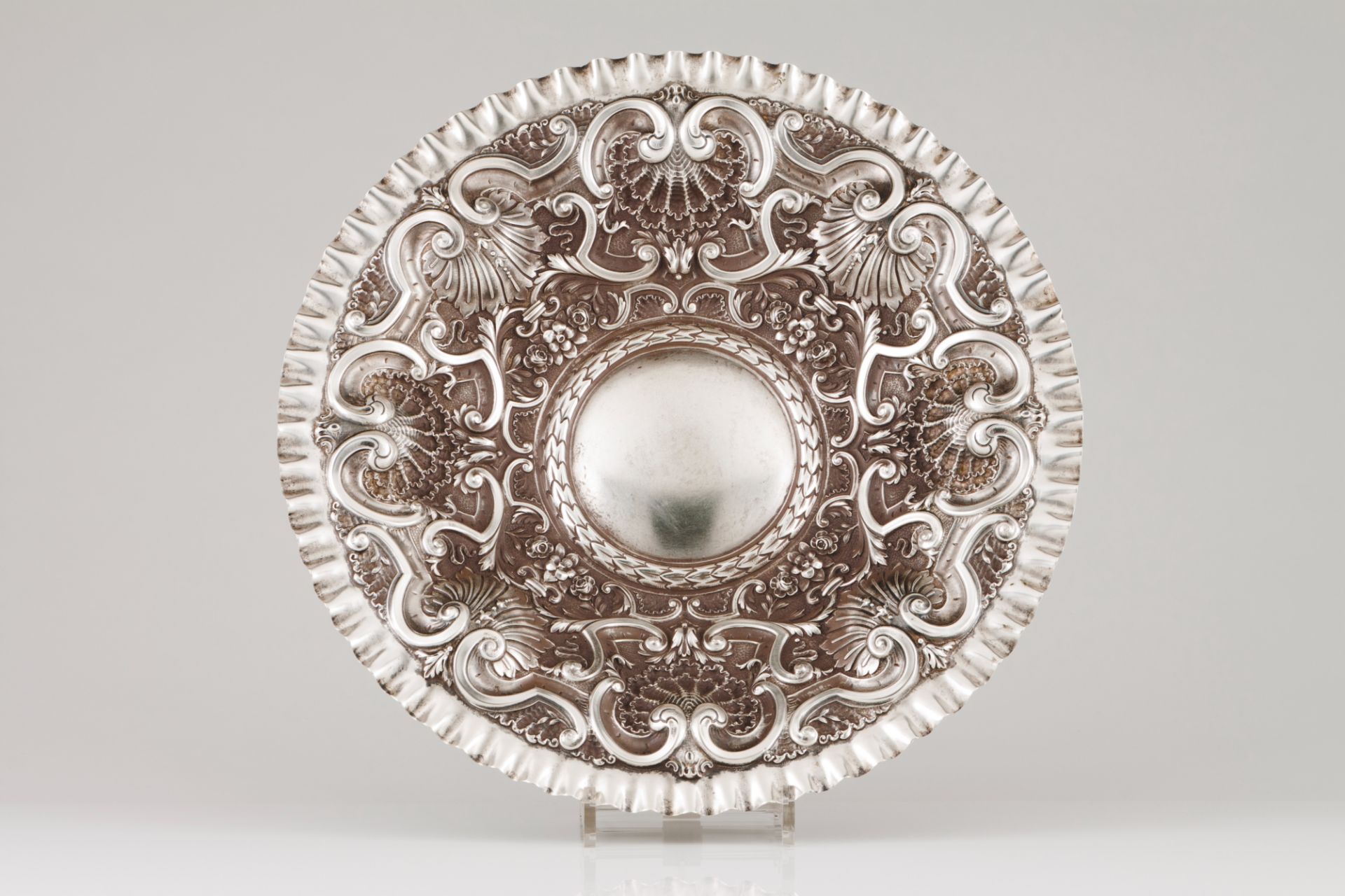 A suspension salverPortuguese silver Profuse raised decoration of foliage motifs, winglets and