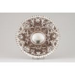 A suspension salverPortuguese silver Profuse raised decoration of foliage motifs, winglets and