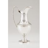 A wine jugPortuguese silver Lip and foot of grooved decoration and beaded frieze Undulating body