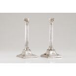 A pair of candlestandsSilver, 19th century Classical columns of Ionic capitals on a square base of