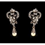 A pair of Romantic era earringsSilver and Portuguese gold Floral and foliage decoration set with