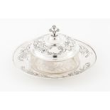 A butter dishPortuguese silver Engraved base and cover of foliage border Engraved glass dish Boat