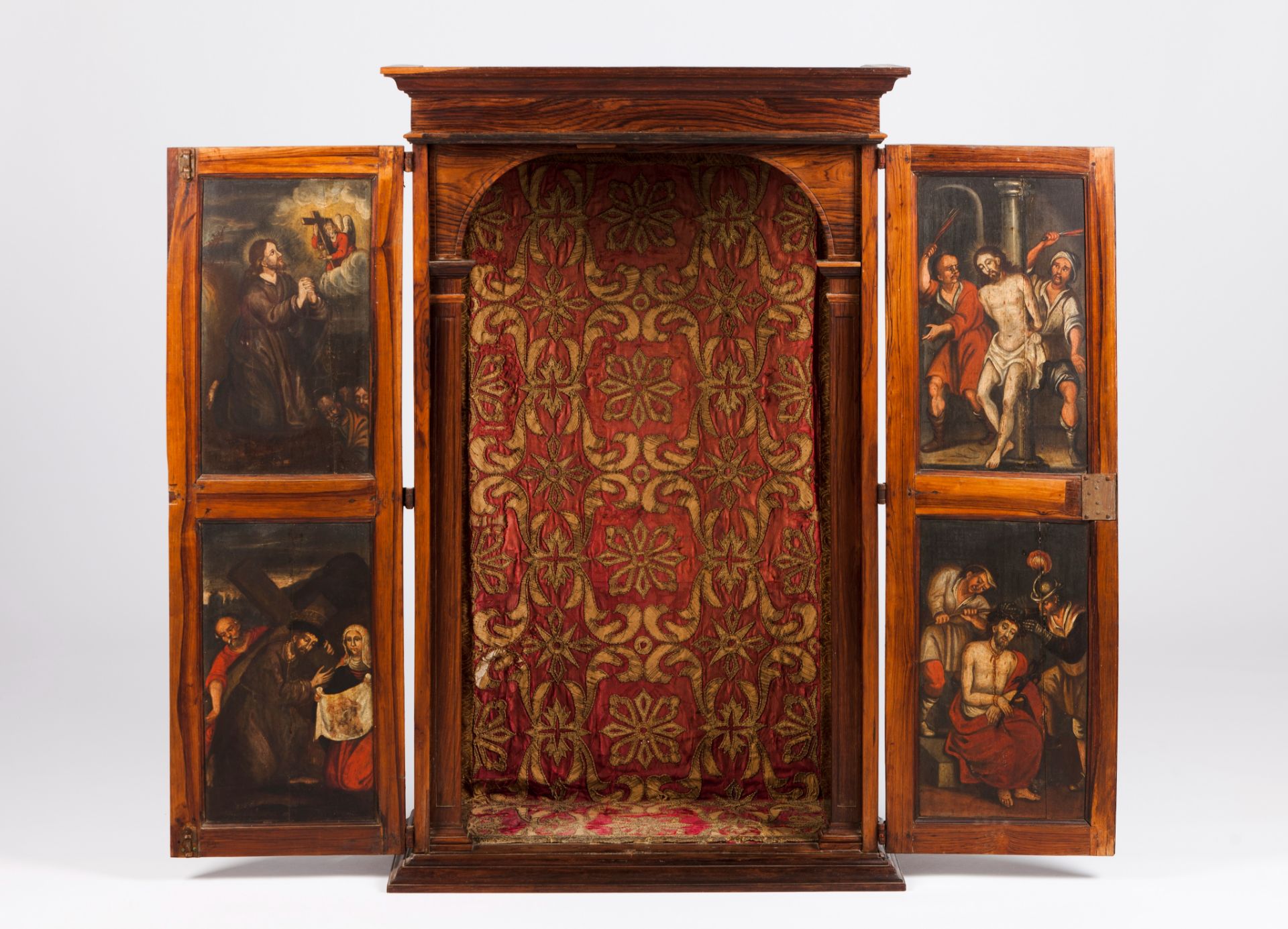 An oratoryRosewood Inner doors painted with scenes of the Passion of Christ Metal thread embroidered
