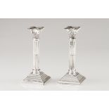 A pair of candle standsPortuguese silver Doric column shaped on a square base of beaded friezes