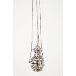 A thuribleSilver, 18th century Pierced, raised and engraved foliage decoration suspended by thread