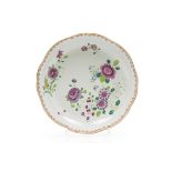 A scalloped deep plateChinese export porcelain Polychrome floral "Famille Rose" enamelled decoration