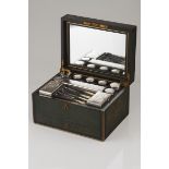 A dressing caseShagreen with various cut crystal boxes with silver covers and various other silver