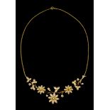 A necklacePortuguese gold Flattened ring chain with 3 central articulated flower bouquets set with
