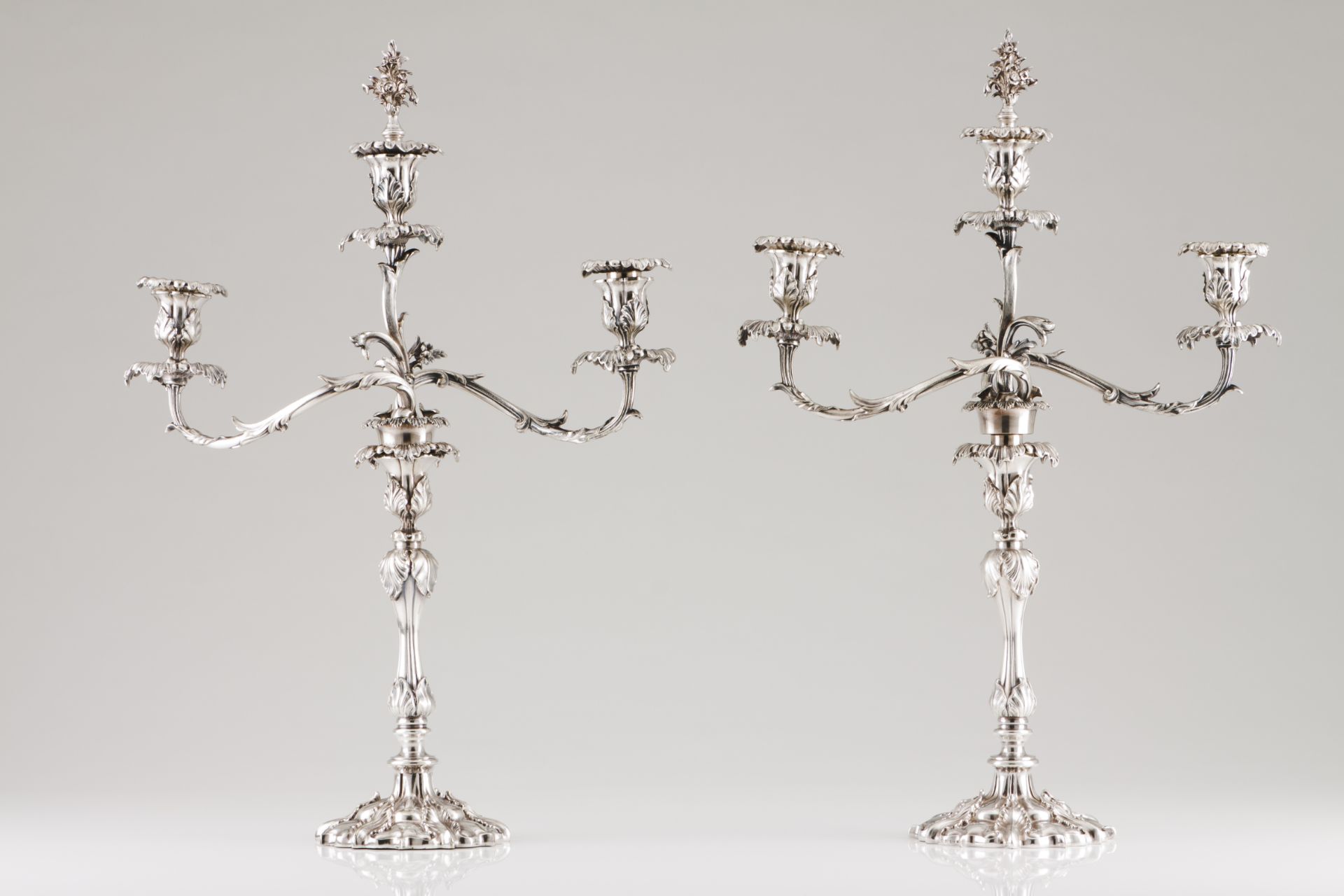 A pair of three branch candelabraSilvered metal Profuse raised foliage decoration Removable branches