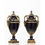 A pair of urns and coversCobalt blue porcelain Bronze mounts of flowers garlands and classical masks