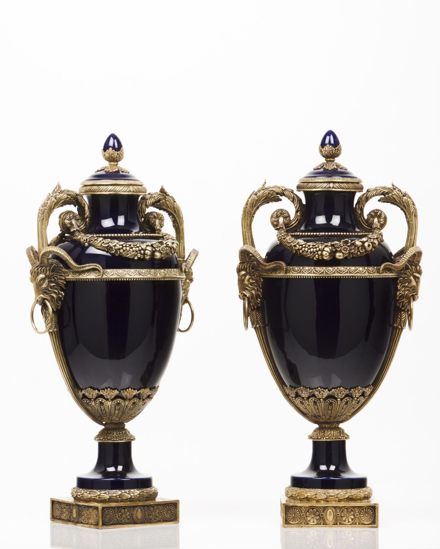 A pair of urns and coversCobalt blue porcelain Bronze mounts of flowers garlands and classical masks