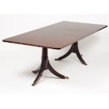 A dining tableSolid and veneered mahogany Rectangular top Supported on two turned shafts of three