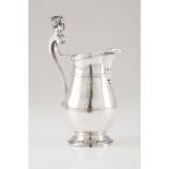 A jugSilver, 18th century Neoclassical decoration Chiselled body with medallion topped by bow and