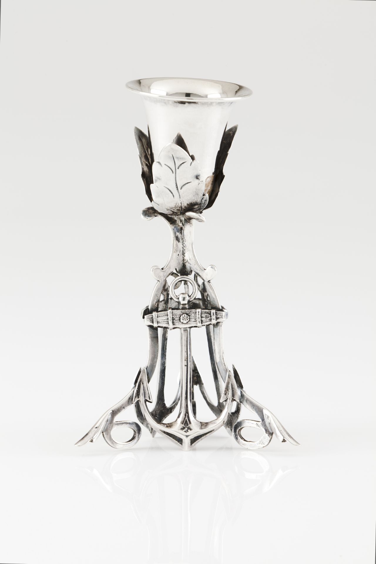 A toothpick holderPortuguese silver, 19th century Leaf shaped cup on anchor base with scroll feet