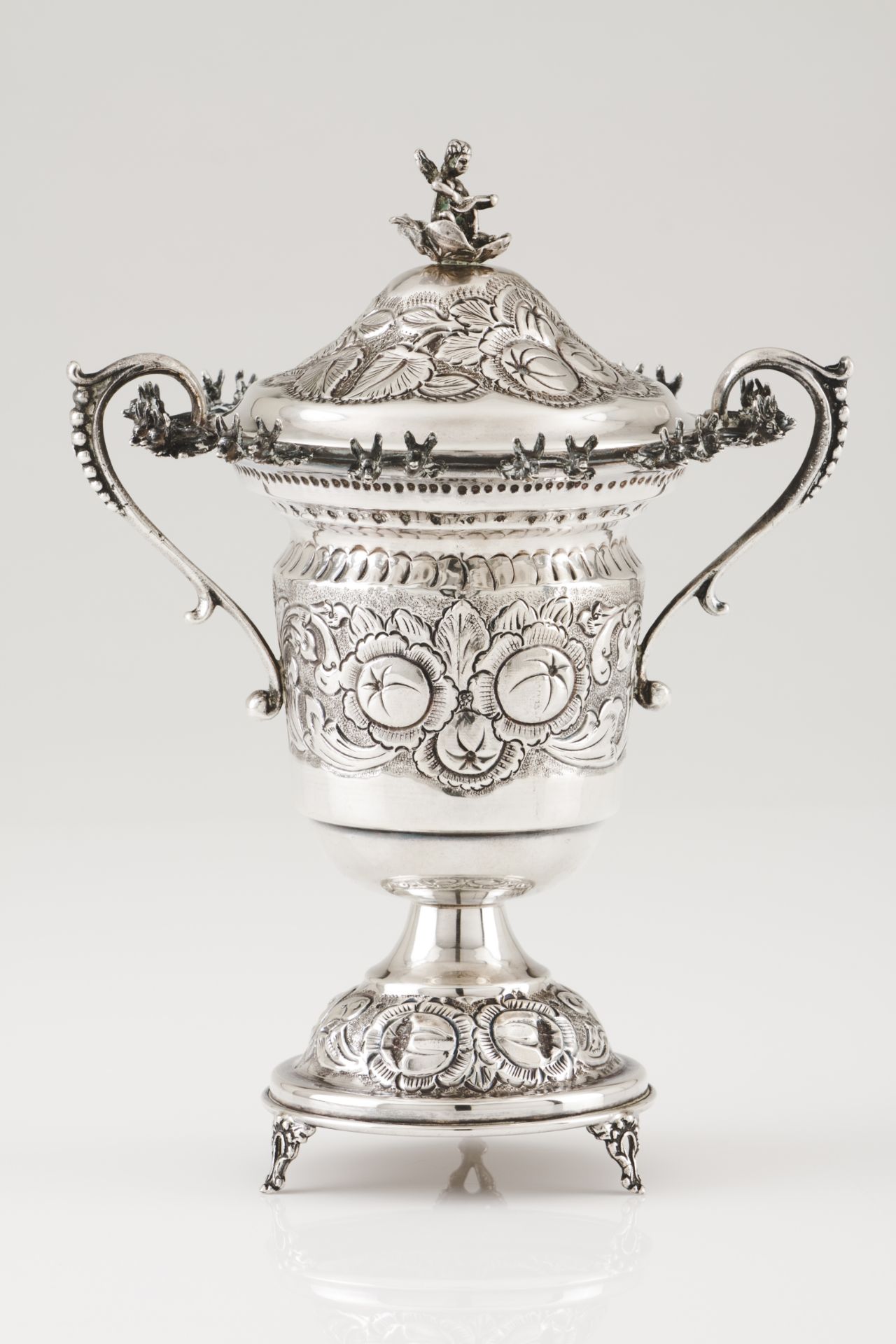 A bowl with coverSilver Raised decoration of fruits and foliage Deer heads' cutlery holders to lip