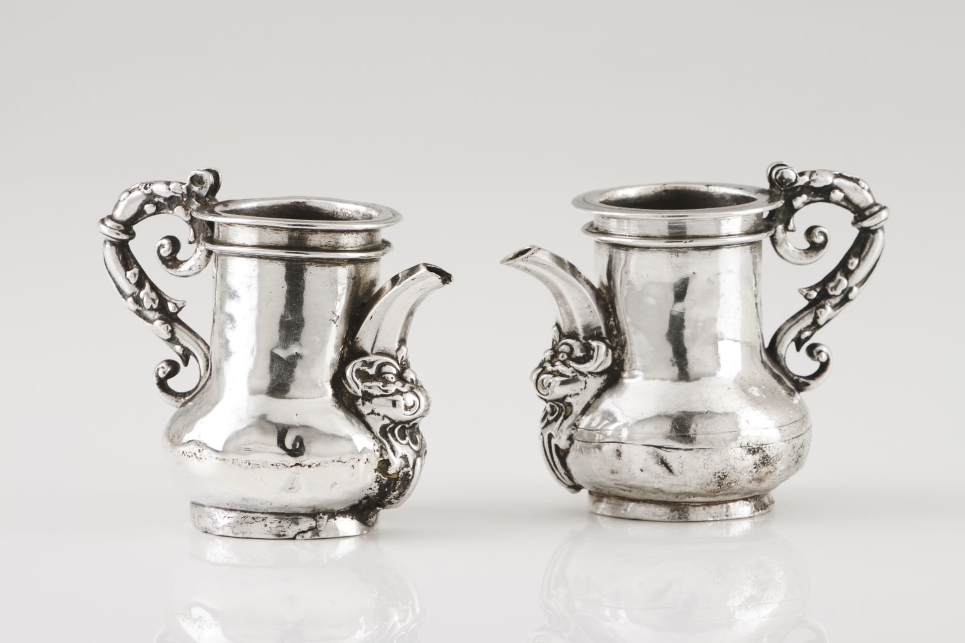 A pair of Holy Oils cruetsSilver, 17th century "S" shaped handle of Baroque decoration Unmarked in