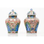 A pair of pots with coversChinese porcelain Baluster shaped body of Wucai decoration after a