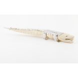A Luiz Ferreira crocodileIvory sculpture with applied engraved silver elements Bead eyes Portugal,