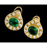 A pair of earringsGold Set with 2 oval cut emeralds (ca. 8x6mm) and 24 brilliant cut diamonds