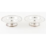 A pair of footed fruit bowlsPortuguese silver Plain body of scalloped lip with engraved foliage band
