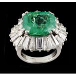 A ringPlatinum Set with one translucent emerald cut emerald (ca. 9.80ct) 6 brilliant cut diamonds (