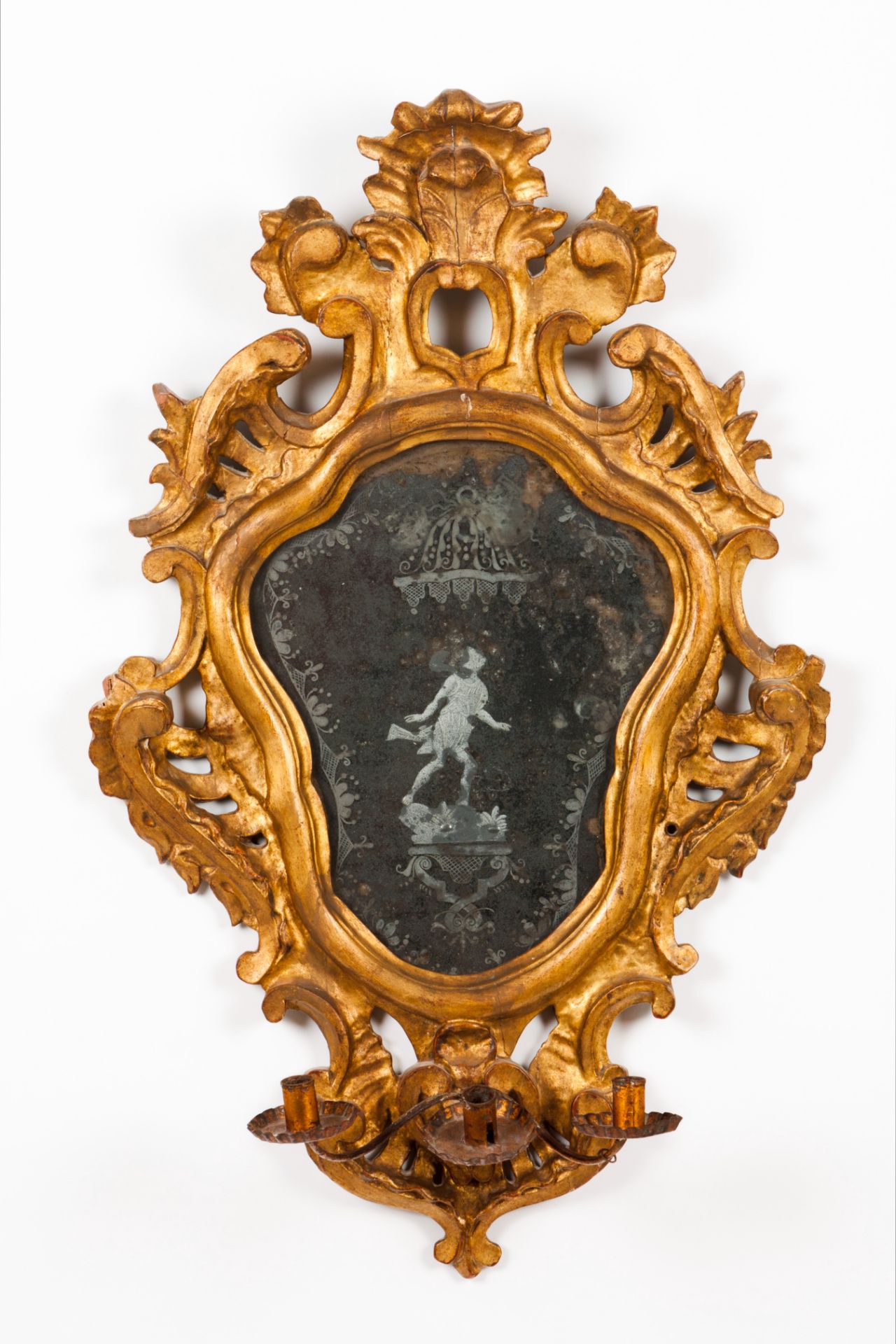 A three branch mirrored wall sconceCarved and gilt wood of rococo decoration Figure engraved