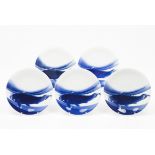 A set of five platesJapanese porcelain Blue decoration depicting a carp Marked to the base C.