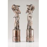 A pair of classical figuresSilvered metal Depicting two classical inspired female figures holding