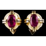 A pair of earringsGold Top cap of raised elements clasping oval cut rubellite (ca. 9x6mm) Later