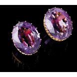 A pair of earringsGold Scalloped crown shaped rim set with oval cut amethyst (ca. 18x16mm) Ram