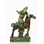A potGreen and brown glazed ceramics depicting a horse riding warrior China, 19th century (losses