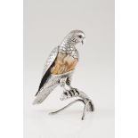 A parrot on a tree trunkPortuguese silver and hardstone Moulded and chiselled decoration with