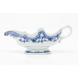 A scalloped lip sauce boatChinese export porcelain Blue and white decoration of trees and birds