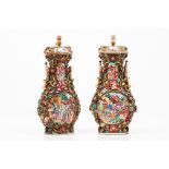 A pair of vases and coversChinese export porcelain Polychrome decoration of low relief oriental