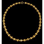 A necklacePortuguese gold Hollow beads of chiselled caps Tiger hallmark 800/1000 (1887-1938) and