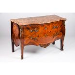 A Louis XV style commodeRosewood, jacaranda and satinwood Two long drawers Bronze hardware Breccia