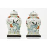 A pair of pots and coversChinese porcelain Polychrome "Famille Rose" enamelled decoration of