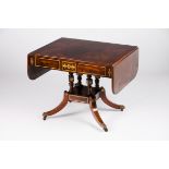 A George III sofa tableSolid and veneered rosewood Inlaid metal decoration Two drawers On turned