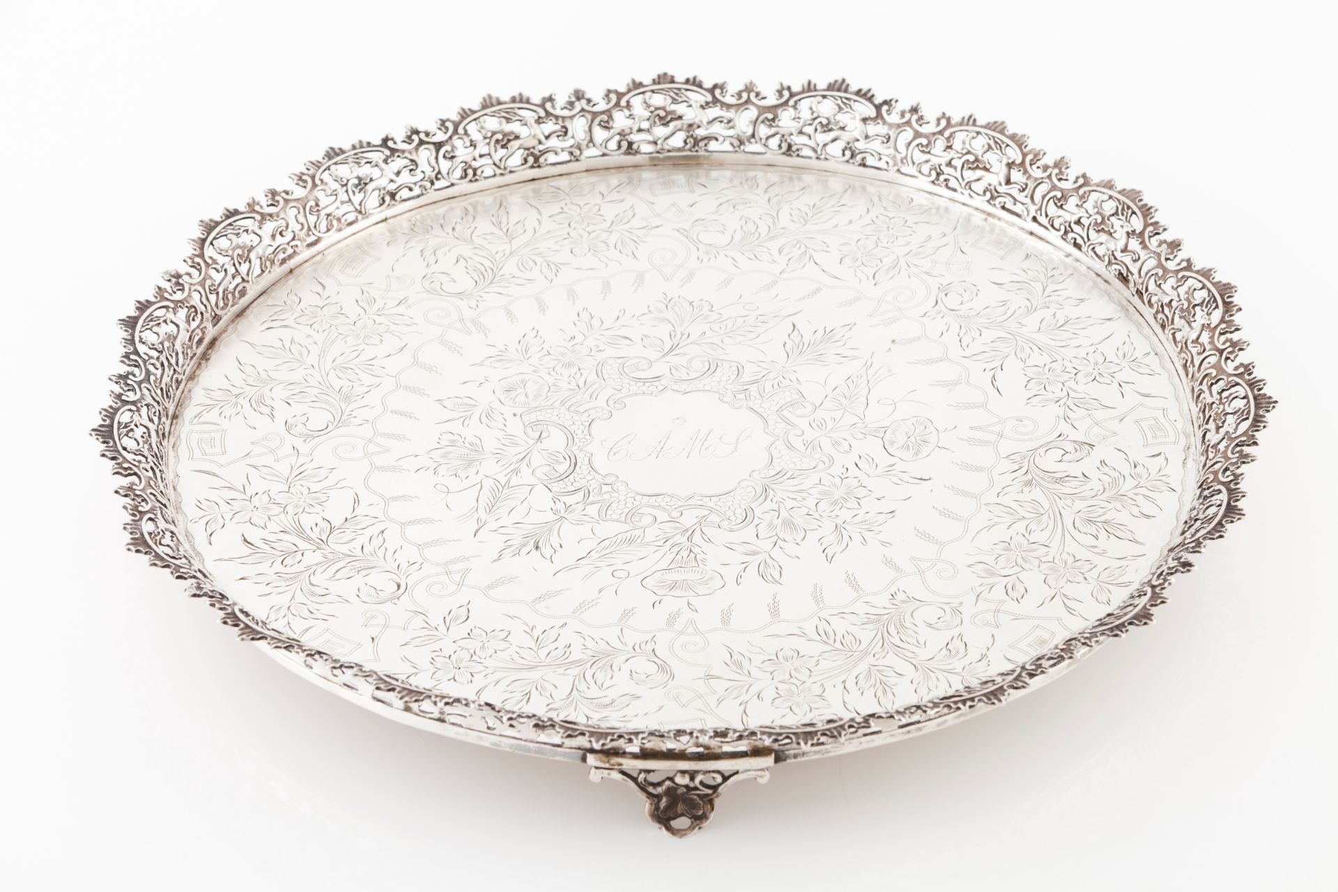 A salverPortuguese silver Engraved and chiselled centre of profuse foliage inspired decoration and
