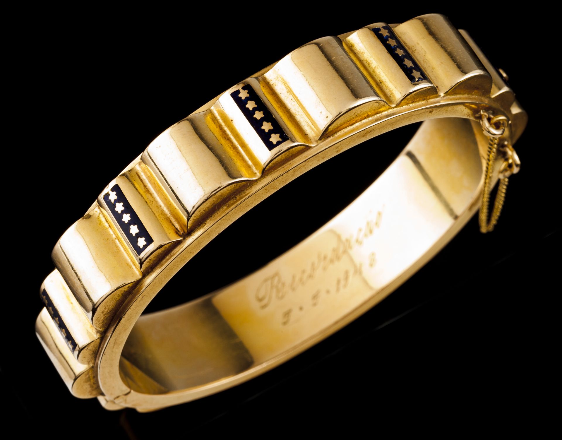 An Art Deco braceletPortuguese gold Hinged articulation, blue enamelled decorative elements with